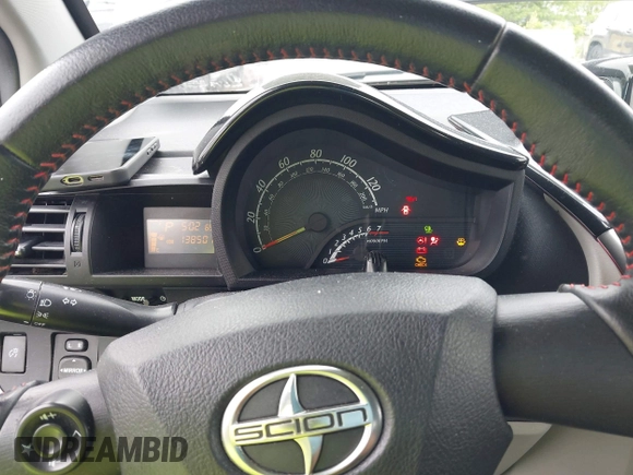 2012 Scion iQ with VIN JTNJJXB08CJ019333, listed as a IAAI auction lot 42348785 with 138,501 mi miles and . Bid and sale history available at DreamBid. Image 7.