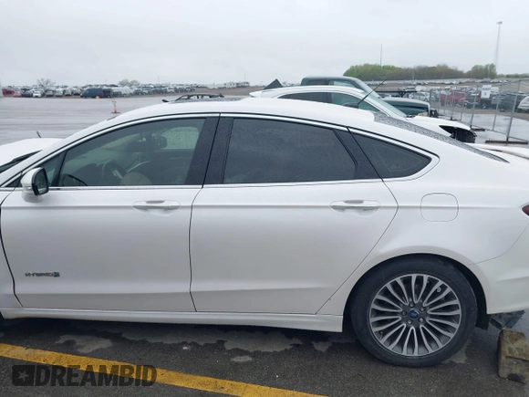 2017 Ford Fusion Hybrid Titanium с VIN 3FA6P0RUXHR317572, выставлен на аукционе IAAI как лот 42170169 с пробегом 138 987 миль миль и . История ставок и продаж доступна на DreamBid. Изображение 14.