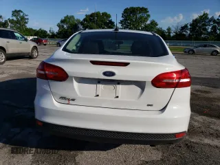 2017 Ford Focus SE with VIN 1FADP3F28HL309268, listed as a Copart auction lot 57995985 with 99,277 mi miles and Salvage title. Bid and sale history available at DreamBid. Image 6.