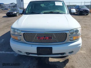 2004 GMC Yukon Denali with VIN 1GKEK63U54J251781, listed as a IAAI auction lot 42099768 with 166,543 mi miles. Bid and sale history available at carsss.com. Image 6.