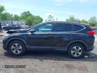 2019 Honda CR-V LX z VIN 2HKRW6H31KH208188, wystawiony jako IAAI lot #42235856 z przebiegiem 140 067 mil mil oraz . Historia ofert i sprzedaży dostępna na DreamBid. Obrazek 14.