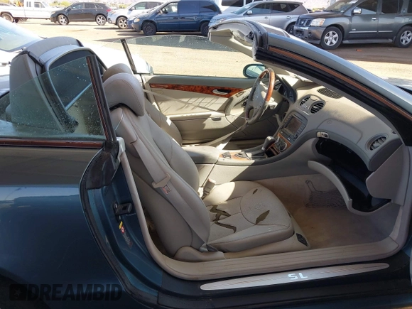 2005 Mercedes-Benz SL 500 with VIN WDBSK75F95F106944, listed as a IAAI auction lot 41970698 with 123,881 mi miles and . Bid and sale history available at DreamBid. Image 8.
