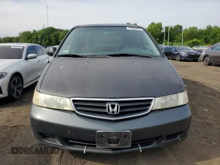 2004 Honda Odyssey EX-RES z VIN 5FNRL188X4B115002, wystawiony jako Copart lot #57883945 z przebiegiem Nie podano mil oraz Szkoda całkowita • Salvage title. Historia ofert i sprzedaży dostępna na DreamBid. Obrazek 5.