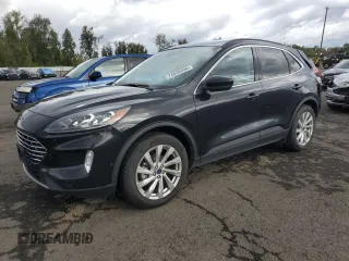 2021 Ford Escape Titanium with VIN 1FMCU9J98MUA73257, listed as a Copart auction lot 74838394 with 41,294 mi miles and Salvage Title. Bid and sale history available at carsss.com. Image 1.