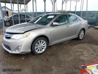 2014 Toyota Camry Hybrid LE with VIN 4T1BD1FK4EU106488, listed as a IAAI auction lot 40794286 with 98,911 mi miles. Bid and sale history available at carsss.com. Image 2.