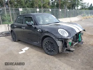2015 MINI Hardtop 4 Door with VIN WMWXS5C58FT833420, listed as a IAAI auction lot 42560244 with 115,446 mi miles and . Bid and sale history available at DreamBid. Image 1.