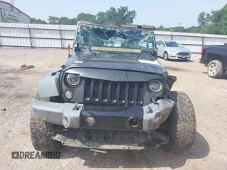 2014 Jeep Wrangler Sport with VIN 1C4AJWAGXEL233647, listed as a IAAI auction lot 39993785 with Not Provided miles and . Bid and sale history available at DreamBid. Image 13.