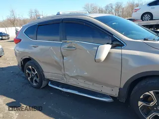 2017 Honda CR-V Touring with VIN 5J6RW2H94HL013536, listed as a IAAI auction lot 41577317 with 97,132 mi miles. Bid and sale history available at carsss.com. Image 6.