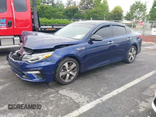 2019 Kia Optima LX z VIN 5XXGT4L31KG328032, wystawiony jako IAAI lot #42208195 z przebiegiem 78 086 mil mil oraz . Historia ofert i sprzedaży dostępna na DreamBid. Obrazek 2.
