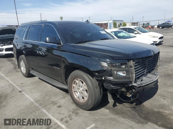 2018 Chevrolet Tahoe LS with VIN 1GNSCAKC9JR201994, listed as a Copart auction lot 53100735 with 182,460 mi miles and Salvage title. Bid and sale history available at DreamBid. Image 4.