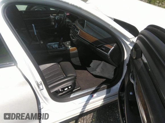 2017 BMW 7 Series 750i with VIN WBA7F0C35HGM21649, listed as a IAAI auction lot 37362691 with 10,000 mi miles and . Bid and sale history available at DreamBid. Image 5.