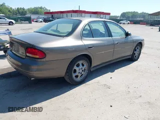 1999 Oldsmobile Intrigue GX z VIN 1G3WH52K5XF334949, wystawiony jako IAAI lot #42252647 z przebiegiem 80 705 mil mil oraz . Historia ofert i sprzedaży dostępna na DreamBid. Obrazek 4.