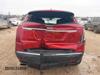 2023 Cadillac XT5 FWD Luxury z VIN 1GYKNAR42PZ147121, wystawiony jako IAAI lot #41315848 z przebiegiem 10 444 mil mil oraz . Historia ofert i sprzedaży dostępna na DreamBid. Obrazek 16.