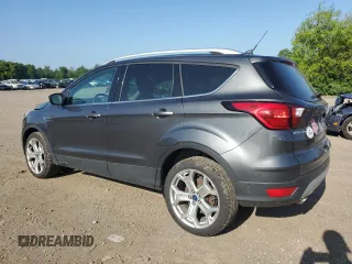2019 Ford Escape Titanium with VIN 1FMCU0J96KUB22884, listed as a Copart auction lot 61979665 with 63,824 mi miles and Salvage title. Bid and sale history available at DreamBid. Image 2.
