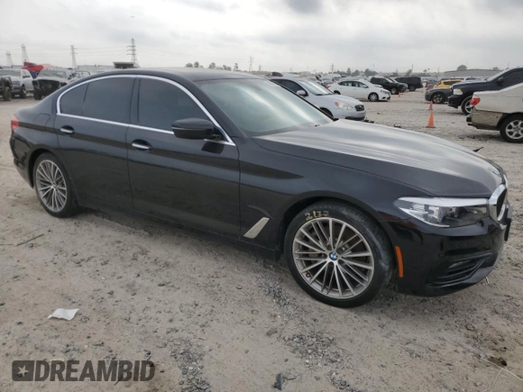 2018 BMW 5 Series 530i with VIN WBAJA5C54JG899845, listed as a Copart auction lot 83007584 with 57,379 mi miles and Salvage Title. Bid and sale history available at DreamBid. Image 4.