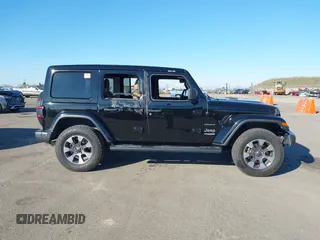 2021 Jeep Wrangler Unlimited Sahara Altitude z VIN 1C4HJXEN5MW659188, wystawiony jako IAAI lot #41414960 z przebiegiem 72 698 mil mil oraz . Historia ofert i sprzedaży dostępna na DreamBid. Obrazek 13.