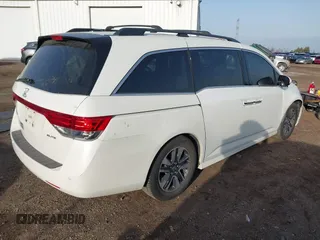 2014 Honda Odyssey Touring with VIN 5FNRL5H97EB037358, listed as a IAAI auction lot 41832825 with 208,894 mi miles and . Bid and sale history available at DreamBid. Image 4.
