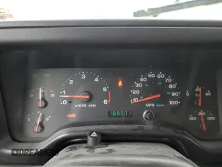 2002 Jeep Wrangler Sport with VIN 1J4FA49S72P701075, listed as a Copart auction lot 66894914 with 169,971 mi miles and Salvage Title. Bid and sale history available at carsss.com. Image 9.