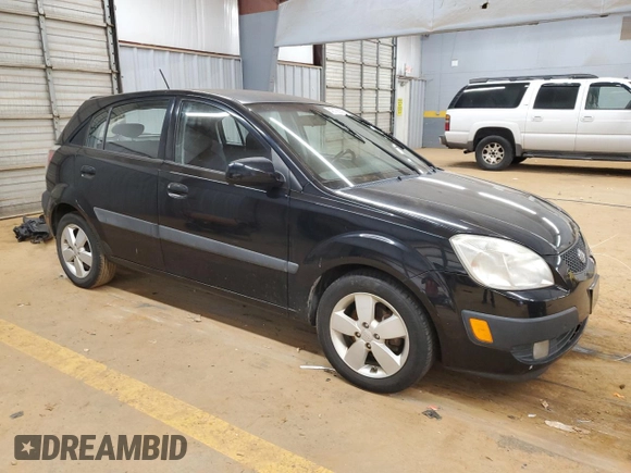 2009 Kia Rio LX with VIN KNADE243896580883, listed as a Copart auction lot 43735505 with 135,726 mi miles and Salvage Title. Bid and sale history available at carsss.com. Image 4.
