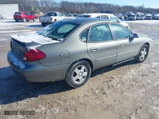 2002 Ford Taurus SEL with VIN 1FAHP56S82G144061, listed as a IAAI auction lot 41610496 with 100,106 mi miles. Bid and sale history available at carsss.com. Image 4.