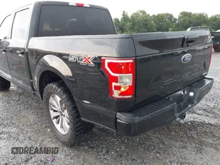 2018 Ford F-150 XL z VIN 1FTEW1CP4JFB01141, wystawiony jako IAAI lot #42703141 z przebiegiem 232 138 mil mil oraz . Historia ofert i sprzedaży dostępna na DreamBid. Obrazek 6.