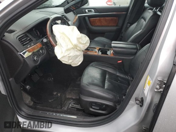 2015 Lincoln MKS with VIN 1LNHL9EK5FG607404, listed as a Copart auction lot 43246995 with Not provided miles and Salvage title. Bid and sale history available at DreamBid. Image 7.