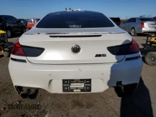 2015 BMW M6 z VIN WBSLX9C51FD160757, wystawiony jako Copart lot #51991315 z przebiegiem 71 133 mil mil oraz Szkody całkowita. Historia ofert i sprzedaży dostępna na DreamBid. Obrazek 6.