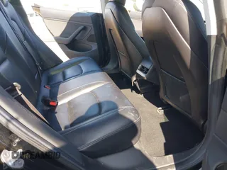 2018 Tesla Model 3 Long Range Battery with VIN 5YJ3E1EA7JF057031, listed as a IAAI auction lot 42139832 with 92,618 mi miles and . Bid and sale history available at DreamBid. Image 8.