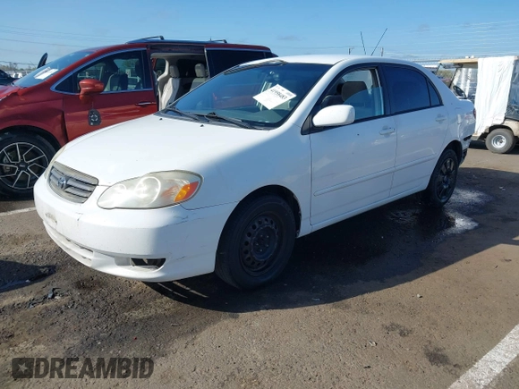 2004 Toyota Corolla CE with VIN JTDBR32E540051928, listed as a IAAI auction lot 41958483 with 299,999 mi miles. Bid and sale history available at carsss.com. Image 2.