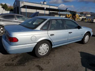 1993 Ford Taurus z VIN 1FACP5216PG197713, wystawiony jako Copart lot #80982424 z przebiegiem 79 330 mil mil oraz Szkoda całkowita • Salvage title. Historia ofert i sprzedaży dostępna na DreamBid. Obrazek 3.