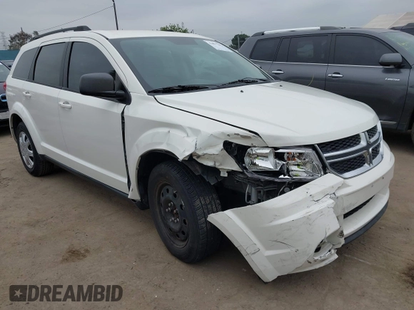 2014 Dodge Journey American Value with VIN 3C4PDCAB8ET141803, listed as a IAAI auction lot 42097292 with 76,339 mi miles and . Bid and sale history available at DreamBid. Image 1.