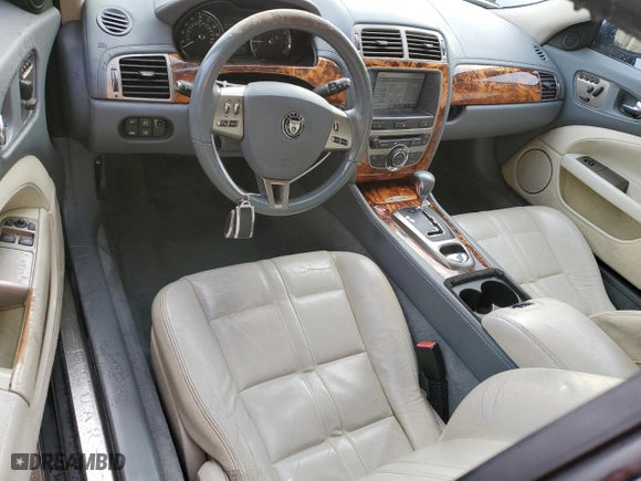 2007 Jaguar XK with VIN SAJWA43B775B07074, listed as a Copart auction lot 86350144 with 117,915 mi miles and Salvage Title. Bid and sale history available at carsss.com. Image 8.
