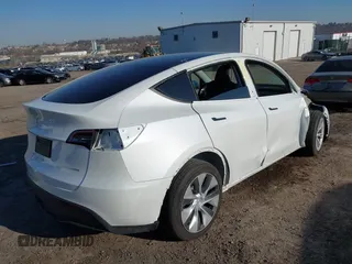 2023 Tesla Model Y Long Range z VIN 7SAYGDEE5PF765326, wystawiony jako IAAI lot #41757113 z przebiegiem 10 461 mil mil oraz . Historia ofert i sprzedaży dostępna na DreamBid. Obrazek 4.