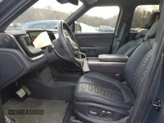 2023 Rivian R1T Adventure z VIN 7FCTGBAA8PN028065, wystawiony jako Copart lot #81941474 z przebiegiem 16 060 mil mil oraz Szkoda całkowita • Salvage title. Historia ofert i sprzedaży dostępna na DreamBid. Obrazek 7.