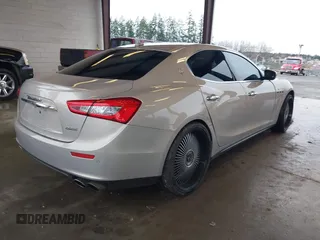 2017 Maserati Ghibli with VIN ZAM57XSLXH1238134, listed as a IAAI auction lot 41871754 with 34,776 mi miles. Bid and sale history available at carsss.com. Image 4.