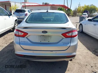 2014 Ford Fusion Titanium Hybrid with VIN 3FA6P0RUXER103516, listed as a IAAI auction lot 42004602 with 128,287 mi miles and . Bid and sale history available at carsss.com. Image 16.