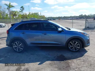 2021 Kia Niro Touring with VIN KNDCC3LC3M5483455, listed as a IAAI auction lot 41678795 with 132,216 mi miles. Bid and sale history available at carsss.com. Image 13.
