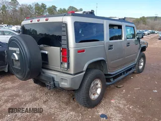 2005 Hummer H2 SUV with VIN 5GRGN23U65H101545, listed as a IAAI auction lot 41426274 with 293,821 mi miles. Bid and sale history available at carsss.com. Image 4.