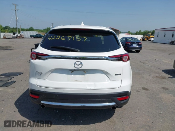 2021 Mazda CX-9 Grand Touring z VIN JM3TCBDY8M0537986, wystawiony jako IAAI lot #42267157 z przebiegiem 25 375 mil mil oraz . Historia ofert i sprzedaży dostępna na DreamBid. Obrazek 17.