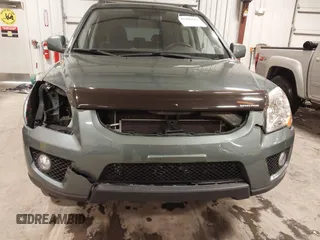 2009 Kia Sportage LX with VIN KNDJE723097558182, listed as a IAAI auction lot 41295142 with 147,200 mi miles. Bid and sale history available at carsss.com. Image 6.