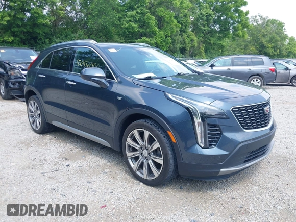 2019 Cadillac XT4 FWD Premium Luxury z VIN 1GYFZCR43KF143980, wystawiony jako IAAI lot #42472400 z przebiegiem 36 496 mil mil oraz . Historia ofert i sprzedaży dostępna na DreamBid. Obrazek 1.