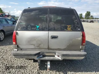 1999 GMC Yukon with VIN 1GKEK13R9XJ740395, listed as a Copart auction lot 83801394 with 185,305 mi miles and Salvage Title. Bid and sale history available at carsss.com. Image 6.