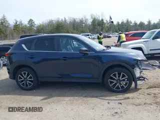 2018 Mazda CX-5 Touring z VIN JM3KFBCM4J0379871, wystawiony jako IAAI lot #41865130 z przebiegiem 48 674 mil mil oraz . Historia ofert i sprzedaży dostępna na DreamBid. Obrazek 14.