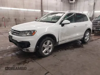 2013 Volkswagen Touareg Lux with VIN WVGEF9BP5DD011511, listed as a IAAI auction lot 41608840 with 167,350 mi miles and . Bid and sale history available at DreamBid. Image 2.