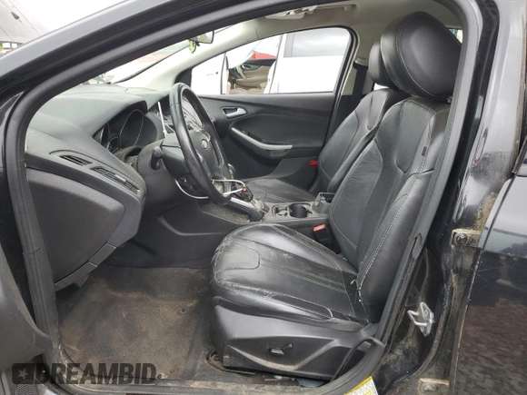 2013 Ford Focus SE z VIN 1FADP3F24DL216824, wystawiony jako Copart lot #52142715 z przebiegiem 149 611 mil mil oraz Szkoda całkowita • Salvage title. Historia ofert i sprzedaży dostępna na DreamBid. Obrazek 7.