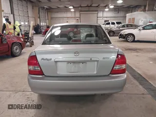 2000 Mazda Protege DX with VIN JM1BJ2226Y0206340, listed as a IAAI auction lot 41645396 with 238,500 mi miles and . Bid and sale history available at DreamBid. Image 16.