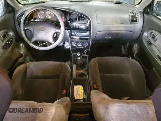 2003 Kia Spectra GS z VIN KNAFB161135104592, wystawiony jako Copart lot #52097205 z przebiegiem 119 206 mil mil oraz Szkoda całkowita • Salvage title. Historia ofert i sprzedaży dostępna na DreamBid. Obrazek 8.