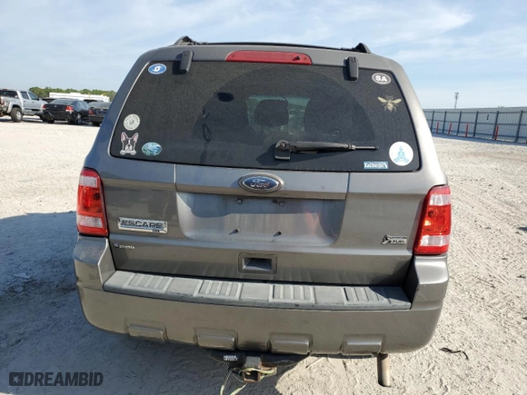 2010 Ford Escape XLT with VIN 1FMCU0DG6AKD05058, listed as a Copart auction lot 50449035 with 127,781 mi miles and Salvage Title. Bid and sale history available at carsss.com. Image 6.