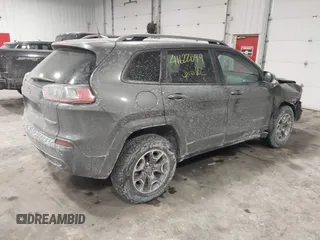 2021 Jeep Cherokee Trailhawk z VIN 1C4PJMBX4MD148597, wystawiony jako IAAI lot #41622099 z przebiegiem 48 452 mil mil oraz . Historia ofert i sprzedaży dostępna na DreamBid. Obrazek 4.
