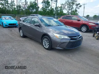 2015 Toyota Camry XLE with VIN 4T1BF1FK6FU935249, listed as a IAAI auction lot 42021192 with 132,248 mi miles. Bid and sale history available at carsss.com. Image 1.